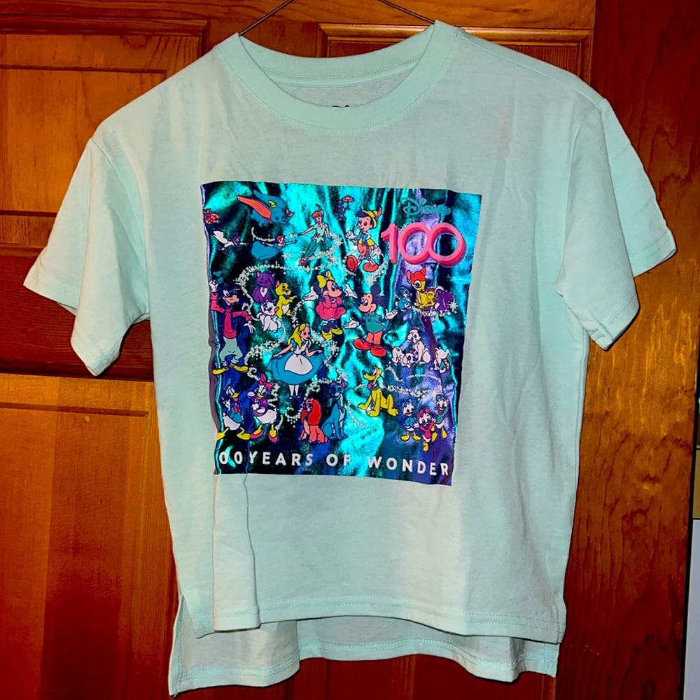 Size 14/16 girls Disney tshirt. Never worn. Still have original packaging. 100yr